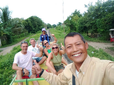 Take a tour into the countryside and ride the Bamboo Train, visit the gift shops, stay overnight in an air conditioned comfort, ride back the noxt morning.